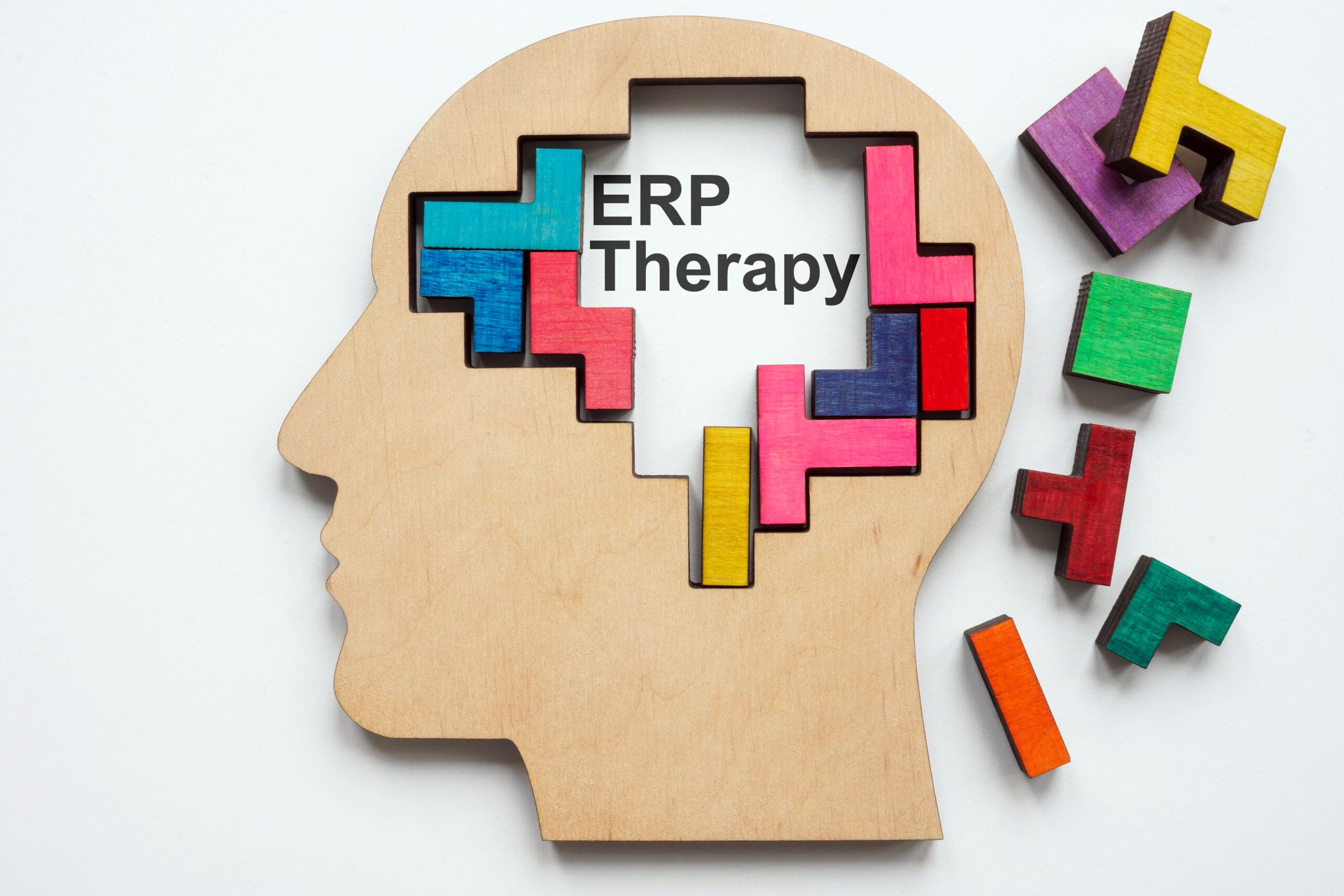 Head model with colored cubes representing Exposure and Response Prevention (ERP) therapy