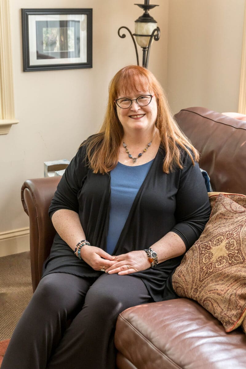 Elizabeth Venart seated in her office at The Resiliency Center